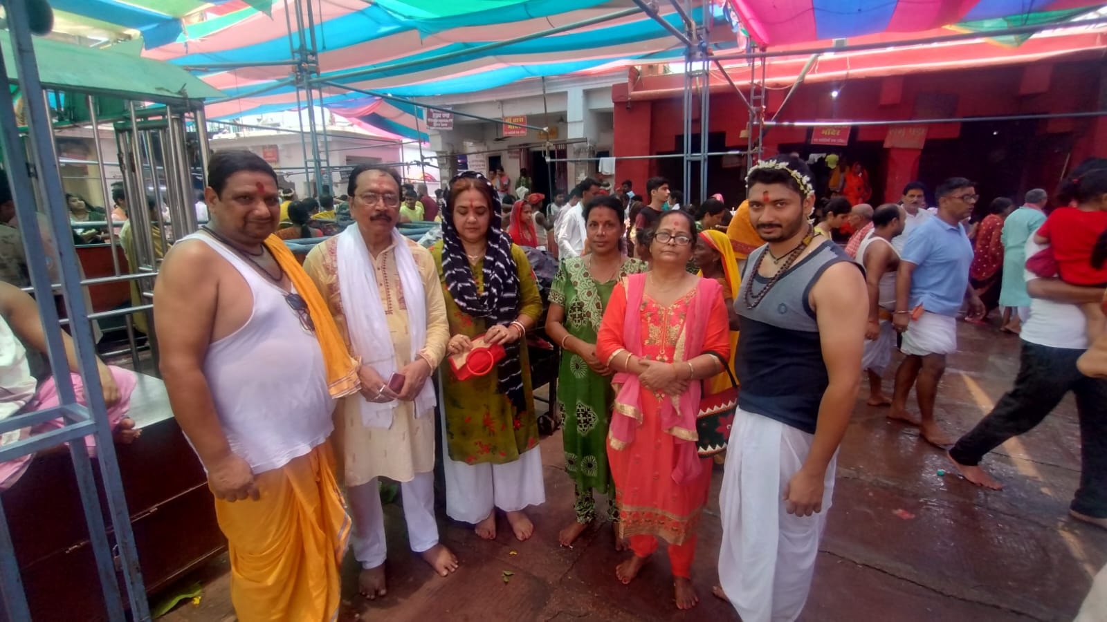 Devotees with prasad at the temple